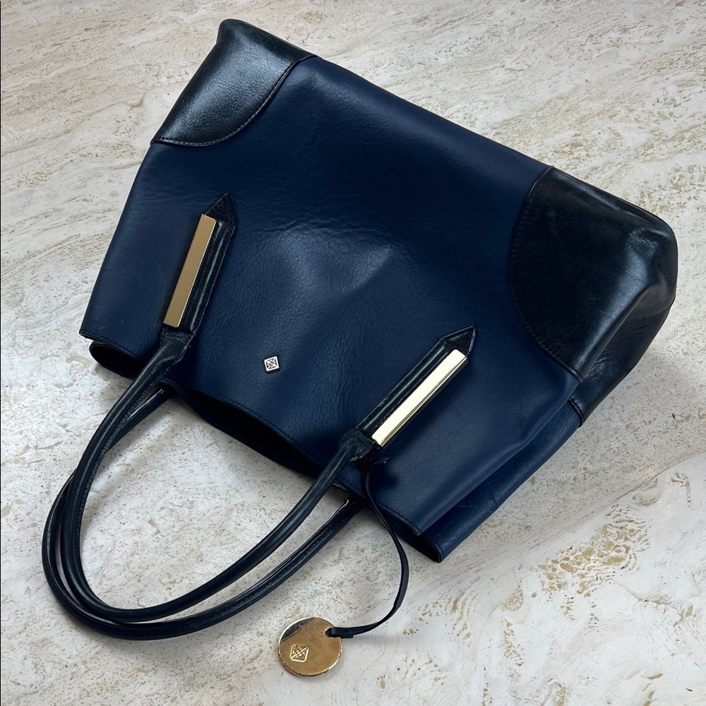 Antonio Melani leather navy and black purse handbag with gold accents